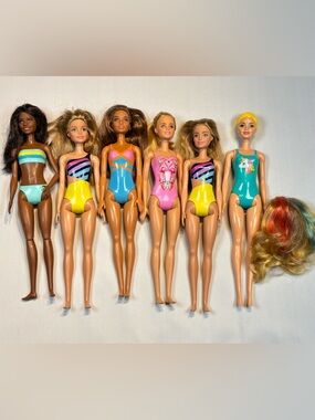 six dolls from the Barbie Beach and Water Play series